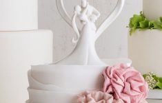 25 Wedding Anniversary Decorations Glazed Porcelain Stylish Embrace Cake Topper Bride And Groom Embrace With Heart Background 25 wedding anniversary decorations|guidedecor.com