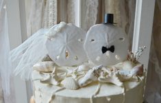Applying the Best Beach Themed Wedding Decorations Sand Dollar Beach Themed Wedding Cake Topper Bride And Groom Etsy