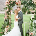 Decorating Wedding Arches Ceremony Arch Covered With Peach And Coral Flowers And Lush Greenery decorating wedding arches|guidedecor.com