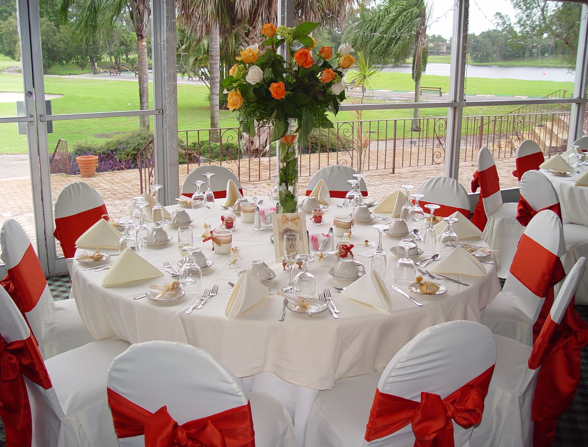 Decorations For Wedding Tables Wedding Table Decorations Plus Cover White Chairs With Red Bows And White Tablecloth Then Neatly Stacked Tableware Also Is Added In The Middle Of The Centerpieces Flowe decorations for wedding tables|guidedecor.com