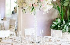 Easy Tips to Create Stunning Wedding Tables Decorations Wedding Lights Candles Centerpiece And White Flowers For Round Table