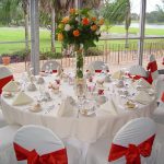 Tablecloth Decorations For Wedding Wedding Table Decorations Plus Cover White Chairs With Red Bows And White Tablecloth Then Neatly Stacked Tableware Also Is Added In The Middle Of The Centerpieces F tablecloth decorations for wedding|guidedecor.com